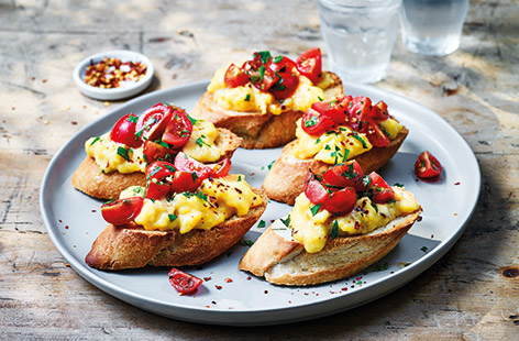 Breakfast, brunch or even lunch, these tasty egg and tomato topped toasts are perfect for feeding a crowd as it's easy to make a big batch in one go. You can get lots of slices out of one single baguette, ready to be topped with creamy Parmesan eggs.