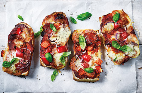 Serve up an easy take on a pizza for a family lunch or TV snack with these baguette melts. Fluffy white baguettes make the perfect base for classic pizza toppings - these are loaded up with a simple tomato and basil sauce, mozzarella and chorizo.