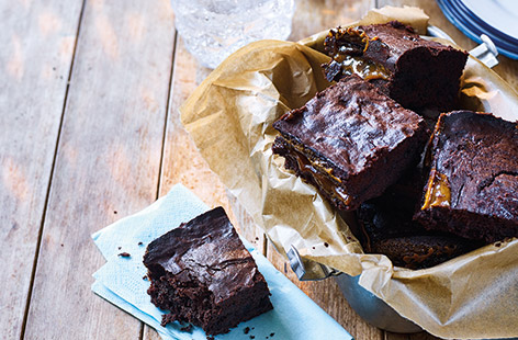 This irresistible traybake is a truly decadent treat, with a hidden layer of golden caramel running through the centre of rich dark chocolate brownies. A dash of bourbon added to the gooey caramel gives this adult-only bake an extra kick.