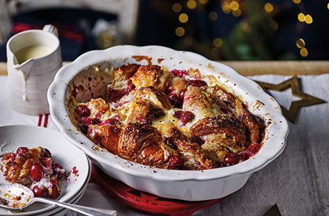 Try a festive twist on a classic bread and butter pudding with this rich croissant version. Perfect for using up any leftover cranberries and cranberry sauce, along with slightly old croissants, this comforting pud is sure to please.