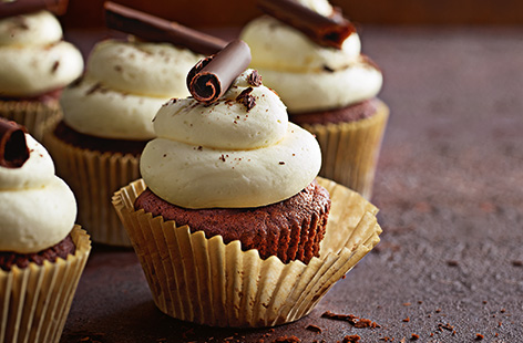 These zesty chocolate orange cupcakes, topped with a swirl of buttercream and glossy chocolate curl, are the perfect bake for an afternoon treat or special occasion. Making your own chocolate curls is sure to impress and an easy decoration to try at home.