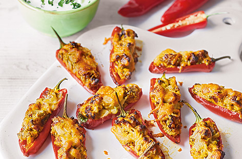 Try these spicy stuffed chillies for an easy snack idea. Filled with crisp chorizo and served with a cooling coriander dip, these are great for sharing with a crowd or for serving as a simple starter.