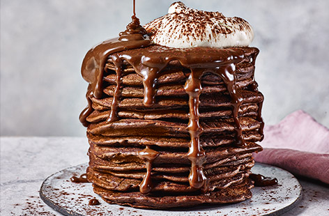 These stunning pancakes are inspired by the rich flavours of a classic Italian tiramisu and served with indulgent whipped cream and lashings of chocolate caramel sauce