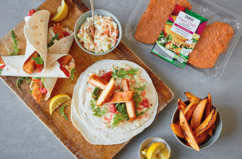 Swap fish fingers for Tesco Plant Chef fish-free fillets in these easy vegan wraps. Made from seasoned soya in crisp tempura batter, slice and fold into wraps with vegan coleslaw, tomatoes and rocket for a plant-based twist on a classic.