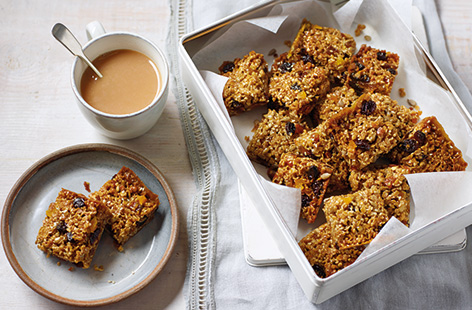 These tasty flapjacks have a classic base of oats, butter and golden syrup for that delicious chewy texture. Our recipe is studded with crunchy seeds, juicy apricots and sultanas – perfect for snacking on-the-go or relaxing with a cuppa. What's more, this easy flapjack recipe takes just 30 minutes to make. Find out how to make flapjacks and you'll always have a tasty treat to hand!