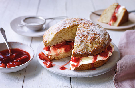Supersize your scones into this giant scone cake recipe for the ultimate afternoon tea. Using ready-made scone mix means this showstopper bake is ready in no time, waiting to be filled with soft whipped cream and fresh strawberries for an easy bake.