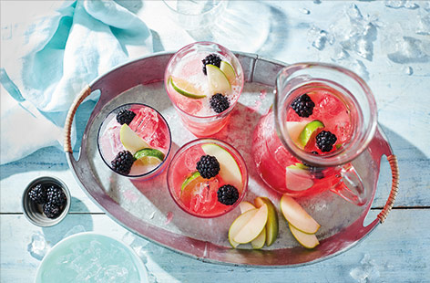 Fruity and refreshing, this blackberry gin fizz recipe is the perfect gin cocktail for sharing on a hot summer’s day. Tart blackberries and zesty lime are balanced with aromatic gin and the floral flavours of sparkling apple and elderflower pressé.