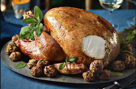 Liven up traditional roast turkey this Christmas with an easy lemon, garlic and sage twist, and serve with wild mushroom and pork stuffing for an extra special treat.