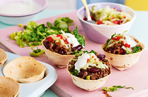Get the kids in the kitchen with these make-your-own taco cups. Swap ordinary taco shells for tortilla wraps and roast in a muffin tin until crisp, before filling with richly spiced beef, apple, pepper and a little soured cream