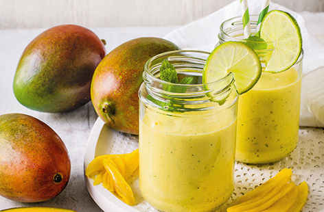 Brighten up your morning with a tropical smoothie, made using the season's best mangoes, zingy lime and warming ginger
