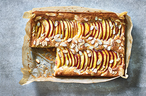 Try this summer twist on a classic Bakewell tart for a pretty dessert that is perfect for packing up and taking on picnics. This easy traybake makes the most of seasonal stone fruit with juicy nectarines topping the soft frangipane and buttery puff pastry 