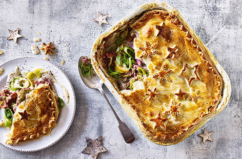 Looking for a comforting Boxing Day dish? This pastry-topped pie is filled with slow-roasted pulled gammon, leeks and potatoes, in a creamy mustard-spiced cheese sauce