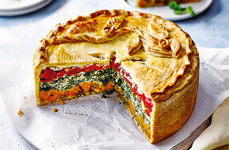 This make-ahead vegetarian pie recipe is perfect for picnics in the sun. It's packed with veggies and a layer of creamy spinach, ricotta and pesto for extra flavour