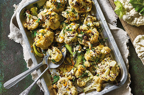 Add a zesty twist to your roast dinner with this easy roasted cauliflower recipe with orange juice dressing