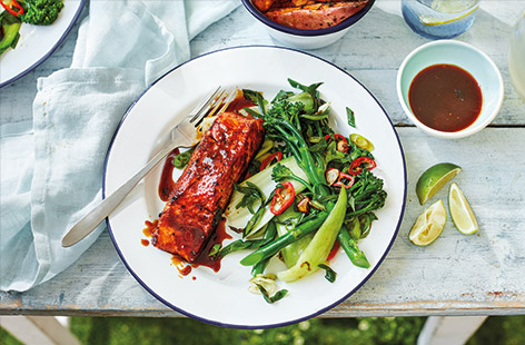 Give salmon a special twist with this sticky-sweet rum glaze. Perfect for a summer lunch, the pan-fried salmon turns charred and caramelised in its rum, ginger and maple syrup marinade, before being served with sweet potato wedges and some spicy stir-fried