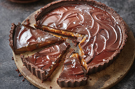 With a buttery bourbon biscuit base and rich caramel centre, this salted chocolate dessert has it all. 