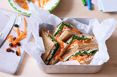 Get the kids to love their packed lunch with this easy healthy sandwich that’s packed with layers of fruit and veg. Taking inspiration from a classic carrot cake for the sandwich filling, orange-flavoured soft cheese and juicy raisins add sweetness.