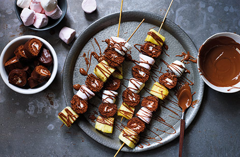 Want an easy sweet treat to share at a party? Pick up a packet of chocolate mini rolls and turn them into super simple mini roll skewers - ready in just 10 mins. Simply slice the mini rolls and layer up with marshmallows and pineapple.