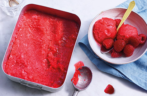 Bright, fruity and refreshing, a simple raspberry sorbet makes the perfect summer dessert to have stashed in the freezer. This homemade version requires a little bit of time but it’s worth it to achieve a smooth sorbet packed with fresh berry flavour.