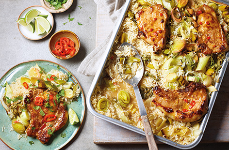 Try this spicy pork traybake for a stress-free family meal – put everything in one large roasting tin and let the oven do the work. Fluffy lemongrass rice with leeks and pak choi is topped with juicy pork chops marinated in chilli, lime and ginger.
