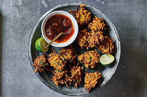 You don't have to leave the comfort of your own home to get some great Indian food. This simple bhaji recipe, rifling with autumunal vegetables like squash and carrot, is an essential and addictive side dish that'll go great with a curry.