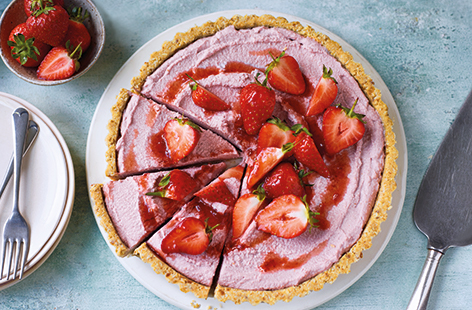 This dairy-free strawberry tart recipe is the perfect vegan dessert for entertaining friends and family. Cashews, oats and dates are blitzed into an easy no-bake tart crust, then topped with a rich coconut and strawberry cream filling.