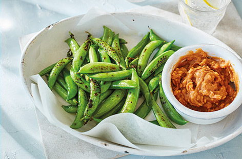 Crunchy, charred and with a hit of zingy chilli and lime, these simple pan-fried sugarsnap peas make a deliciously healthy snack idea – especially when served with a quick, chunky satay dipping sauce.