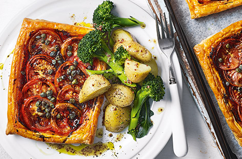 Celebrate juicy tomatoes at their summer best with this simple tomato tart recipe, perfect for an easy summer lunch or weeknight dinner. 