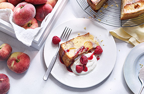 Make the most of sweet flat 'Doughnut' peaches in this summery upside-down cake recipe with tangy raspberry coulis.