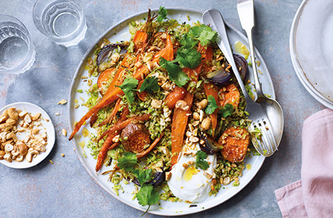 Serve up a colourful veggie supper with this hearty pilaf, packed with carrots, sweet potato, red onions and broccoli. The root veg is roasted in spices, then tossed with nutty wild rice and grated broccoli for a healthy vegetarian feast. 