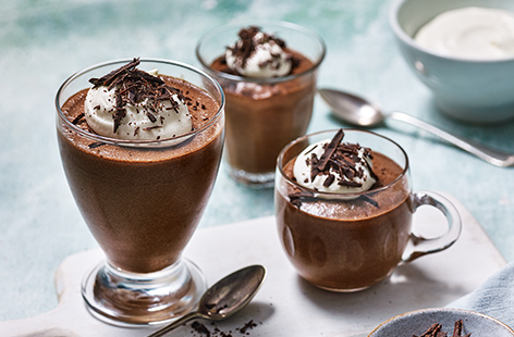 Rich and creamy chocolate mousse is an absolute classic dessert and our easy chocolate mousse recipe is suitable for all cooks, even beginners. Whip up the mousse with dark chocolate, eggs and a little butter and sugar, then allow to set overnight, before serving with whipped cream and chocolate shards, if you like.