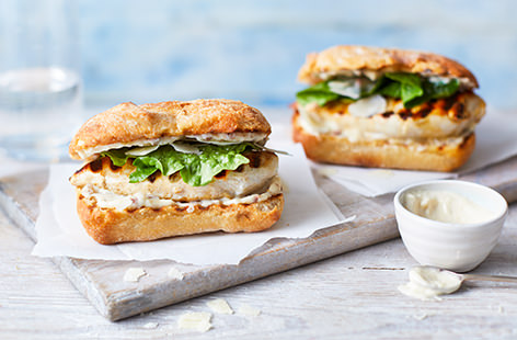 This chicken Caesar salad-inspired burger gets its swagger from a creamy, Parmesan-laced mayonnaise. Rather than fiddling around with mince, we simply pound chicken breasts to resemble burger patties, and then pan fry.