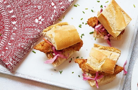 Impress your guests with these light party treats, made with fish goujons, crunchy pink slaw and creamy chive mayonnaise