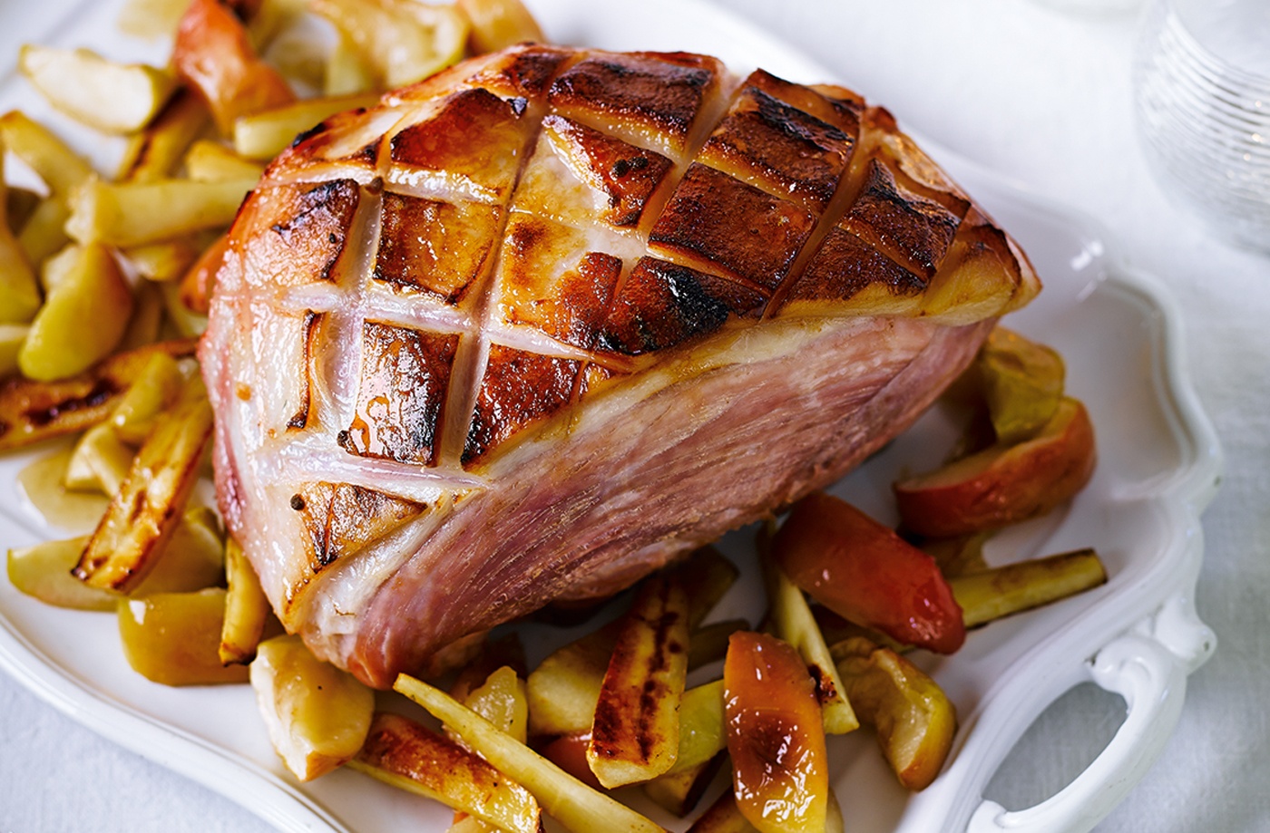 Calvados and honey glazed ham with baked apples and parsnips recipe