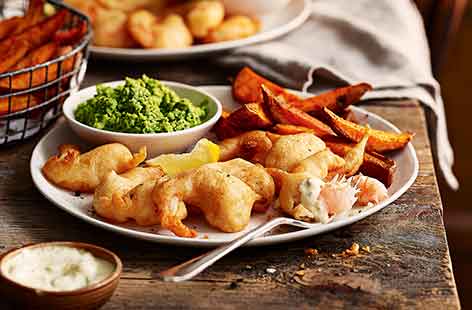 This homemade version of seaside favourite fish and chips is the ultimate weekend treat. Beer batter gives extra crisp results on the scampi, whilst using sweet potatoes for the chips adds a tasty new twist on this classic meal.