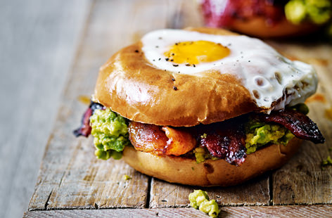 Bagels are the perfect vessel to create this Mexican-inspired egg in a hole. Jazz up rashers of crispy streaky bacon with a sweet and spicy mix of chipotle, paprika and maple syrup and serve with a zingy tomato guacamole and perfectly cooked eggs