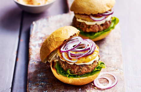 Bring home the sunshine with these hot-off-the-grill tropical burgers. Succulent pork and juicy pineapple, topped with slaw, makes this summer's tastiest meal between two buns. 
