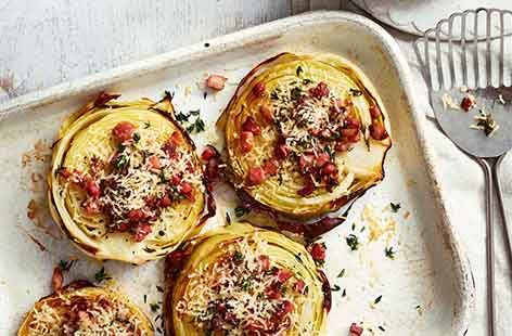 Roasting cabbage completely transforms this familiar winter veg. Thick cabbage steaks go deliciously caramelised and crisp after just 30 minutes in the oven, whilst a sprinkling of Parmesan and crunchy pancetta add a delicious finishing touch.
