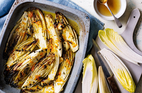 This caramelised chicory packs a flavour punch, roasted with a good hit of garlic and a sweet orange, honey and thyme sauce. Also known as endive, chicory has crisp, tightly packed leaves and a delicate, slightly bitter flavour.