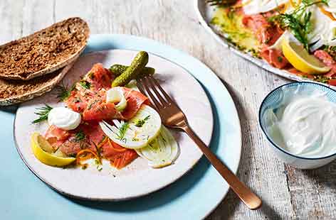 Cheat's gravadlax marinates for just an hour for an easy starter flavoured with fresh orange and lemon. 