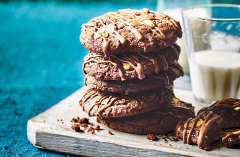 These triple chocolate cookies are a chocoholics dream come true, with irresistible soft and fudgy centres and generous helpings of melting dark, white and milk chocolate. And the best bit? They can be on the table in just 25 minutes. 