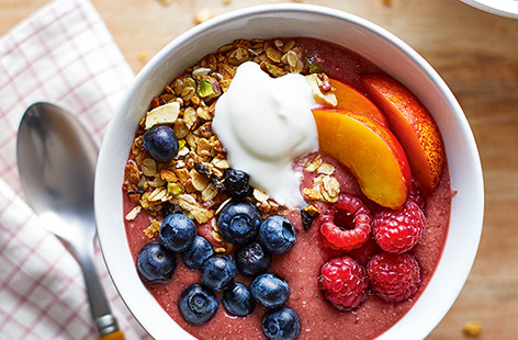 Enjoy this super quick, fruity smoothie bowl for breakfast. Blitz together fresh berries, juicy nectarine and granola before topping with yoghurt and more fruit for a bright breakfast ready in five minutes. 