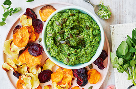 With its strong peppery flavour and bright green hue, watercress adds a flavour punch to this creamy guacamole. Make your own crisps at home - simply bake slices of beetroot, sweet potato and parsnip for a healthy spin on the classic snack  