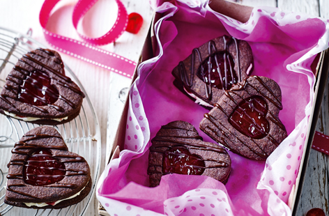 Show loved ones just how much you care with these gorgeous jam heart biscuits. Perfect as a Valentine's Day gift or for a special occasion, these simple chocolate biscuits are sure to hit the sweet spot with their vanilla frosting and raspberry jam filling