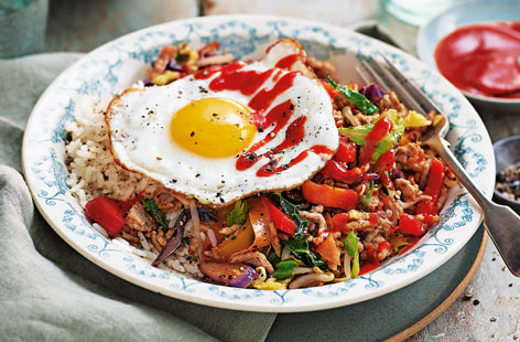 This Korean-inspired rice bowl is brimming with brightly coloured veg and chilli stir-fried pork. The fried egg is a must, as the runny yolk acts as a sauce that coats the rice and combines the flavours of the dish