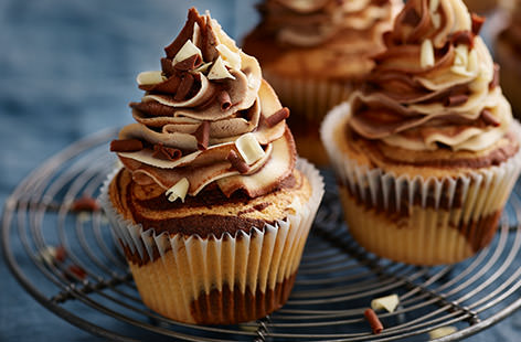 Chocolate lovers will love these rich, chocolate milkshake cupcakes. This recipe turns a simple vanilla cupcake into a double marbled masterpiece with swirls of vanilla and chocolate cake, topped with swirls of creamy icing.