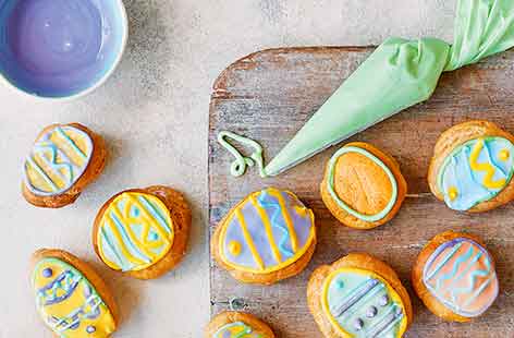 We've given classic choux buns a vibrant Easter makeover! Topped with pretty, pastel-coloured Easter egg decorations and filled with a fruity raspberry cream