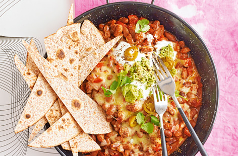 Everyone's favourite Mexican sharing snack just got healthy! Using wholemeal tortilla wraps for the nachos gives added fibre and serving them with spicy pinto beans is a great source of protein.