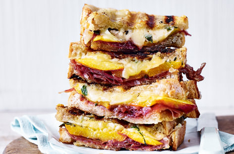 Sarnies don’t have to be strictly savoury affairs. Here we pair thin slices of ripe nectarine with salty prosciutto and thyme grilled cheddar and gruyere cheese for a killer combination.
