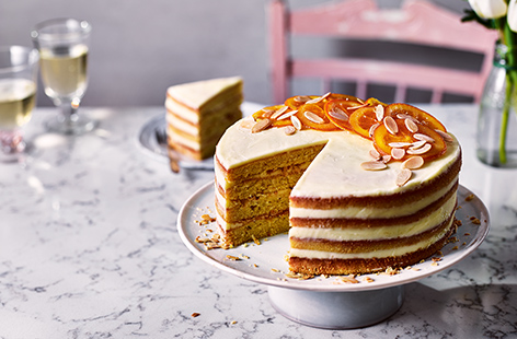 This elegant cake is the perfect way to treat Mum this Mother's Day. Candied orange slices are a stylish extra touch that bring the wow factor to this four-layered cake with a light orange and almond sponge, all sandwiched together with creamy almond butte